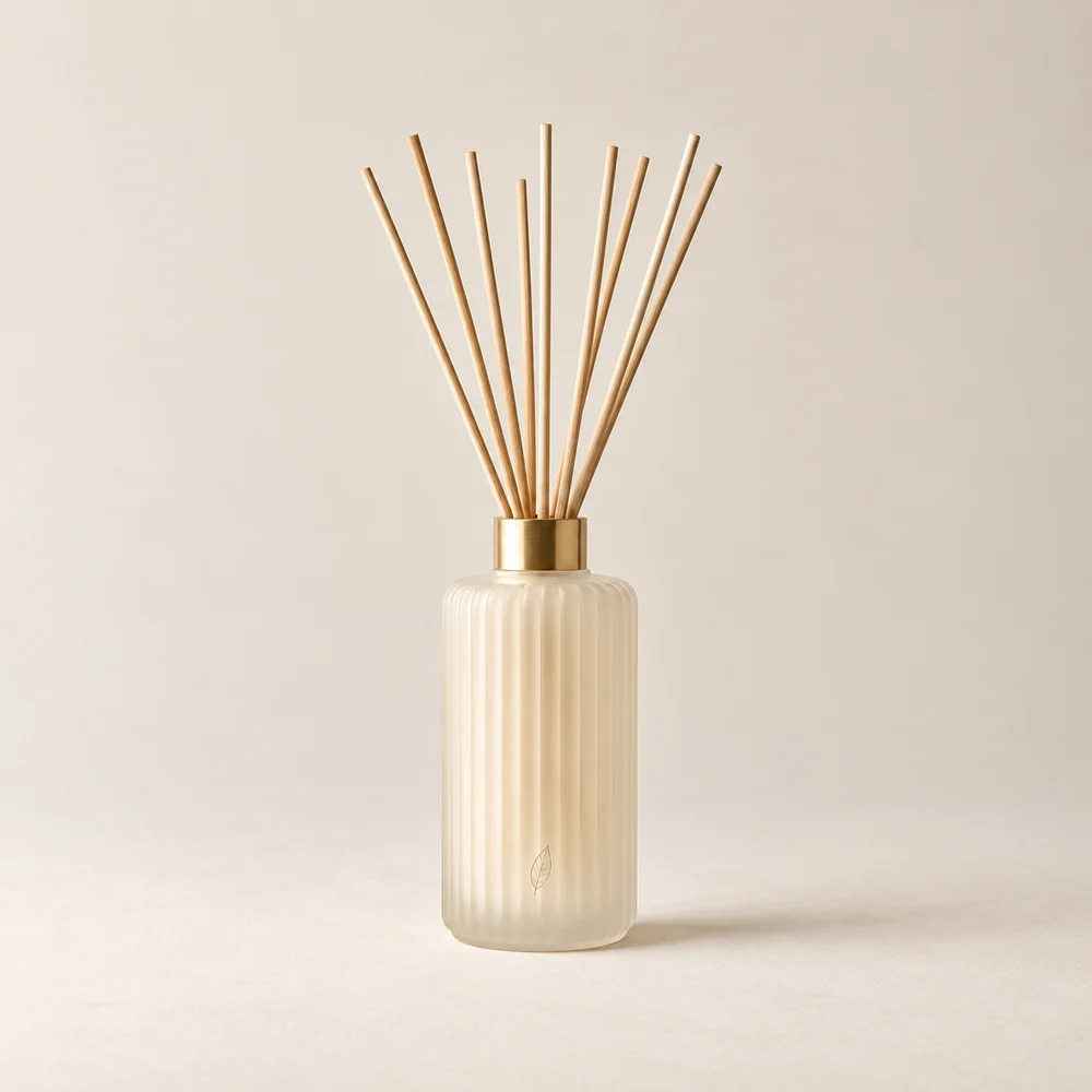 Evergreen Ritual Reed Diffuser in its botanical packaging on a warm ivory background.